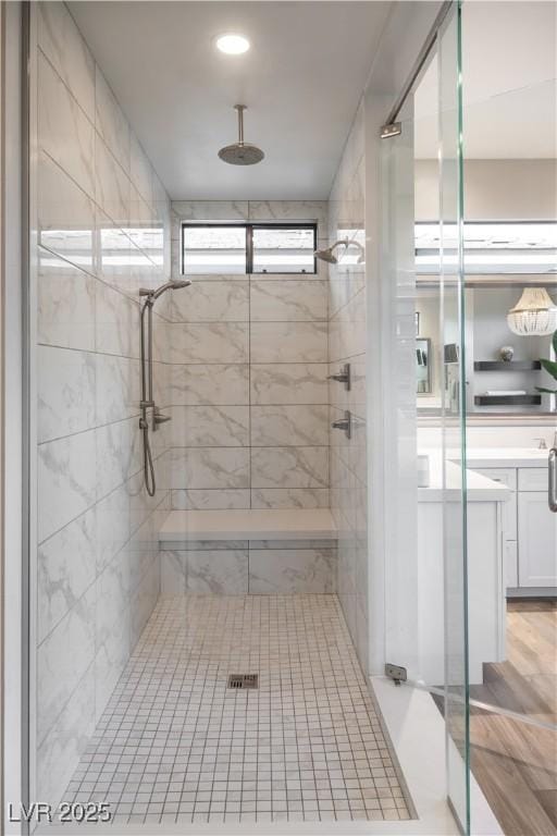 bathroom with vanity and a shower stall