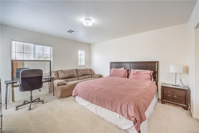 bedroom with carpet floors and visible vents