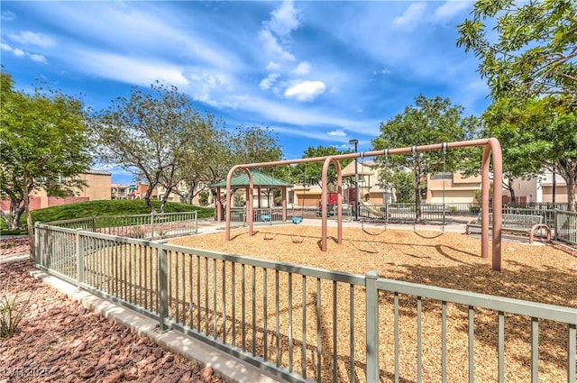 communal playground featuring fence