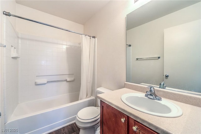 bathroom featuring toilet, shower / bath combo with shower curtain, wood finished floors, and vanity