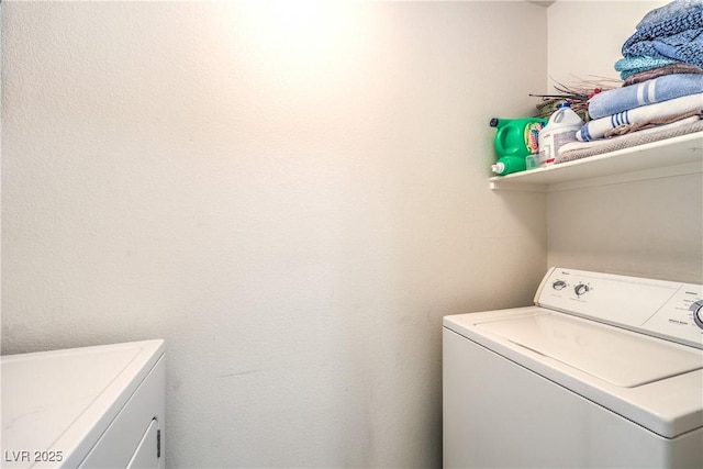 laundry room featuring laundry area and washer and clothes dryer