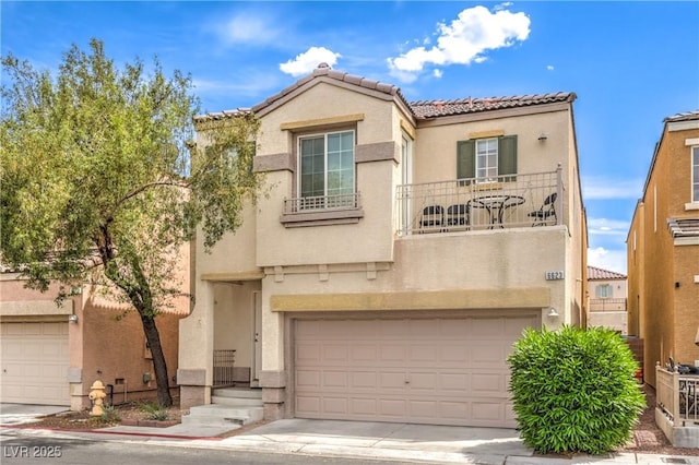 view of front of home with an attached garage, stucco siding, a balcony, and a tile roof
