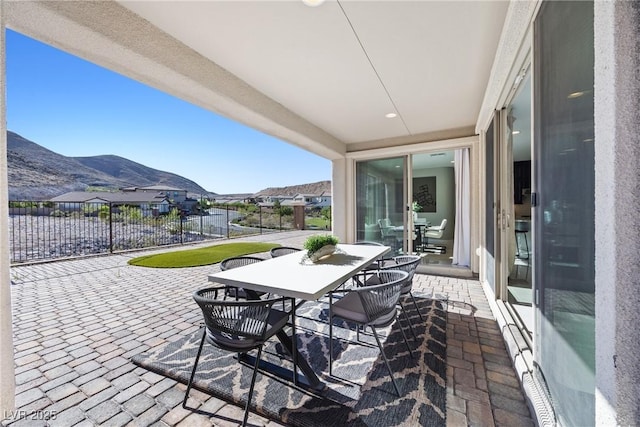 12705 Coastline Shadow St, Las Vegas, NV 89141 - view of patio / terrace featuring a mountain view and outdoor dining area