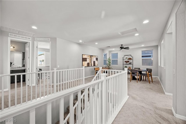 12705 Coastline Shadow St, Las Vegas, NV 89141 - hall with an upstairs landing, carpet, recessed lighting, baseboards, and attic access