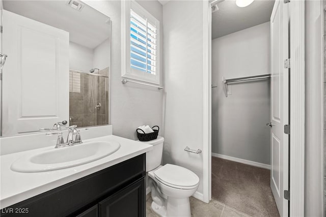 12705 Coastline Shadow St, Las Vegas, NV 89141 - bathroom with tiled shower, vanity, toilet, and baseboards
