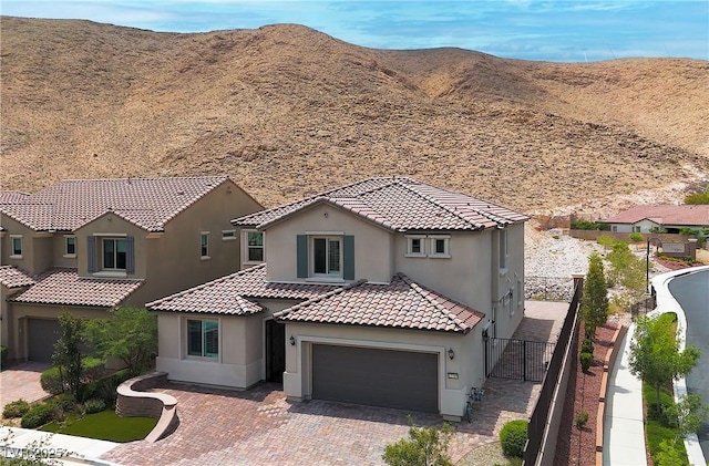 12705 Coastline Shadow St, Las Vegas, NV 89141 - view of front of property featuring stucco siding, decorative driveway, a mountain view, a tile roof, and an attached garage