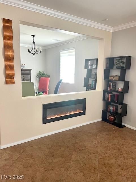 welcome area with a glass covered fireplace and a chandelier