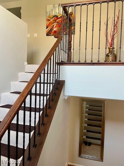 stairway featuring baseboards