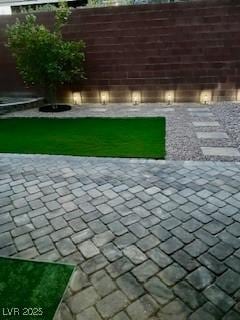view of yard featuring a patio area and fence