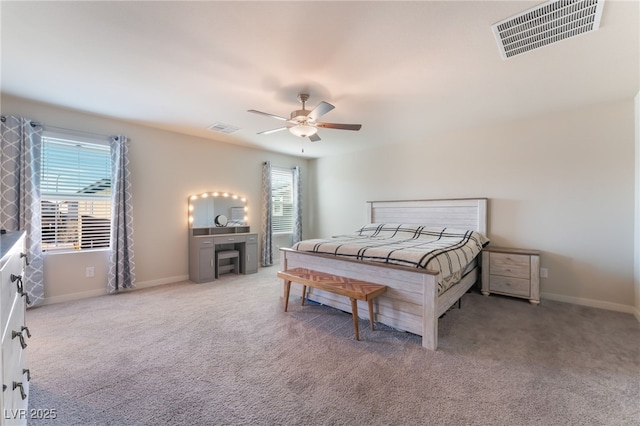bedroom with visible vents, a ceiling fan, and carpet floors