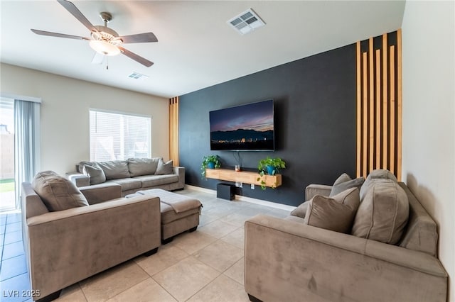 living room featuring visible vents, ceiling fan, and light tile patterned flooring