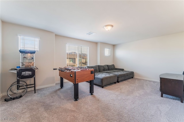 rec room featuring baseboards, visible vents, and carpet