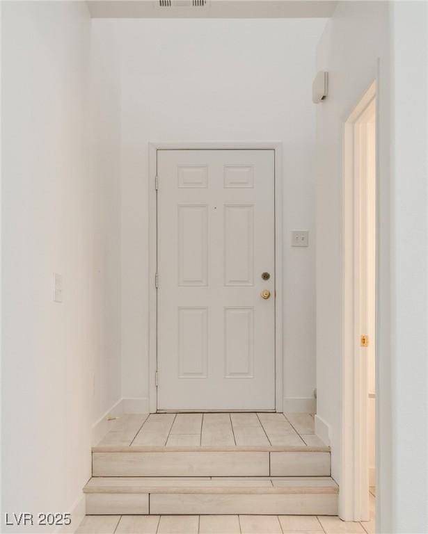 8824 Charm Canyon Ave, Las Vegas, NV 89178 - entryway featuring baseboards, visible vents, and tile patterned floors