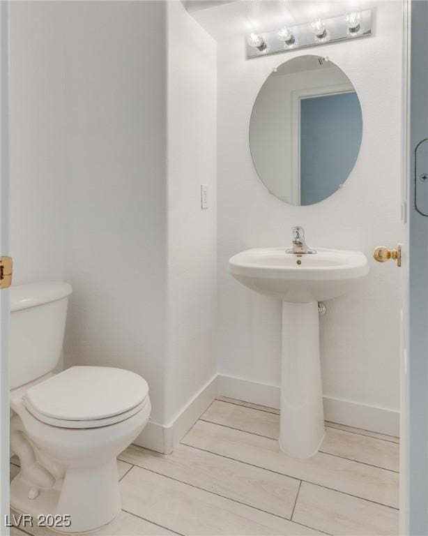 8824 Charm Canyon Ave, Las Vegas, NV 89178 - half bath with baseboards and toilet