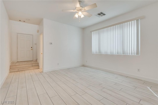 8824 Charm Canyon Ave, Las Vegas, NV 89178 - spare room featuring baseboards, a ceiling fan, light wood finished floors, and visible vents