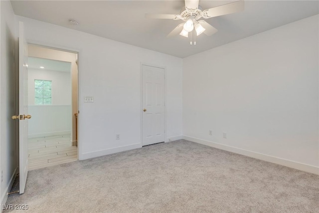 8824 Charm Canyon Ave, Las Vegas, NV 89178 - unfurnished bedroom with carpet floors, baseboards, and a ceiling fan