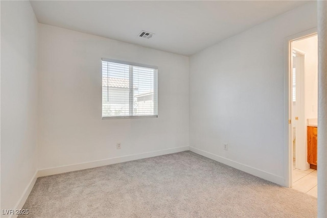 8824 Charm Canyon Ave, Las Vegas, NV 89178 - unfurnished room featuring baseboards, visible vents, and light carpet