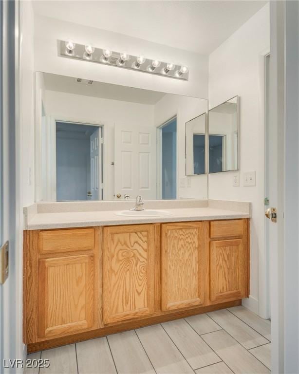 8824 Charm Canyon Ave, Las Vegas, NV 89178 - bathroom with vanity and visible vents