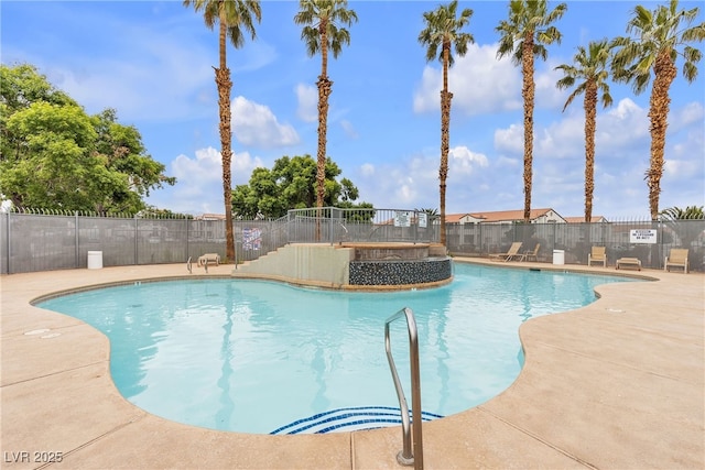 pool with fence and a patio area