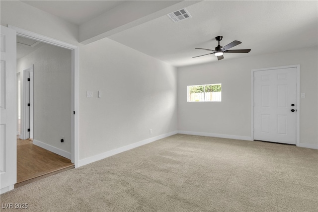 unfurnished room with carpet flooring, ceiling fan, visible vents, and baseboards