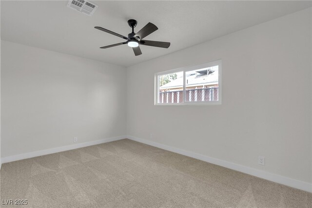 1424 Balzar Ave, Las Vegas, NV 89106 - empty room featuring light colored carpet, baseboards, and a ceiling fan