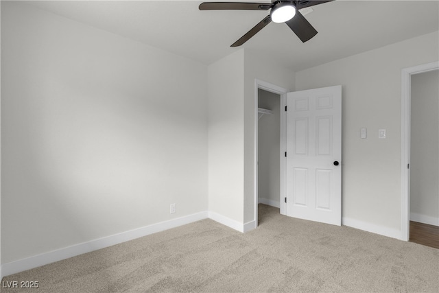 unfurnished bedroom featuring baseboards, carpet, and a ceiling fan