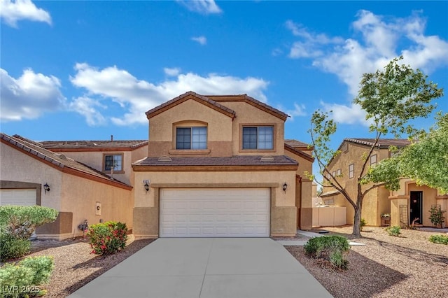 6525 Bismark Hills St, North Las Vegas, NV 89084 - view of front of house featuring driveway, an attached garage, and stucco siding