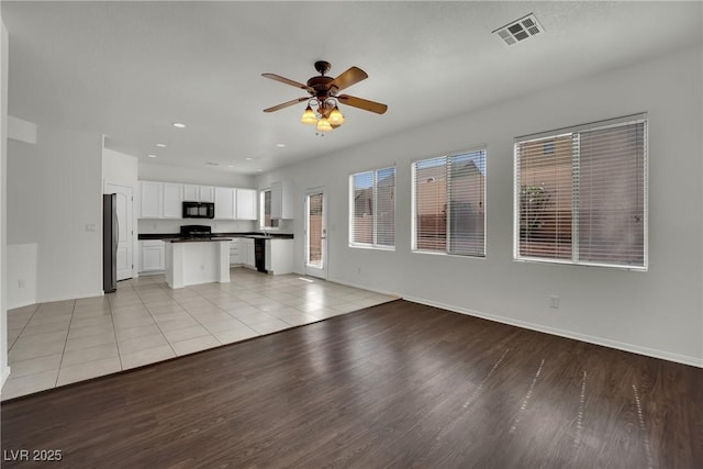 6525 Bismark Hills St, North Las Vegas, NV 89084 - unfurnished living room featuring a ceiling fan, light wood-style floors, recessed lighting, and baseboards