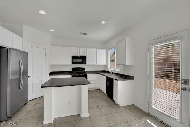 6525 Bismark Hills St, North Las Vegas, NV 89084 - kitchen featuring black appliances, a sink, dark countertops, light tile patterned floors, and recessed lighting