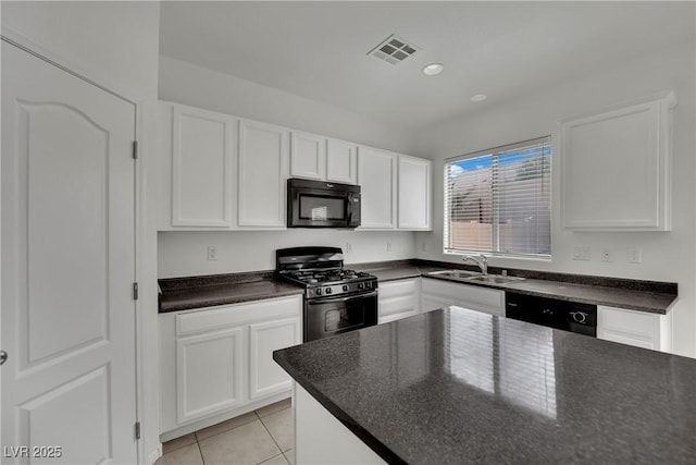 6525 Bismark Hills St, North Las Vegas, NV 89084 - kitchen with black appliances, a sink, light tile patterned flooring, white cabinets, and recessed lighting