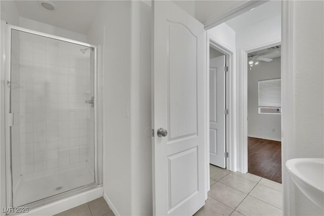 6525 Bismark Hills St, North Las Vegas, NV 89084 - full bathroom with tile patterned floors, a stall shower, and ceiling fan