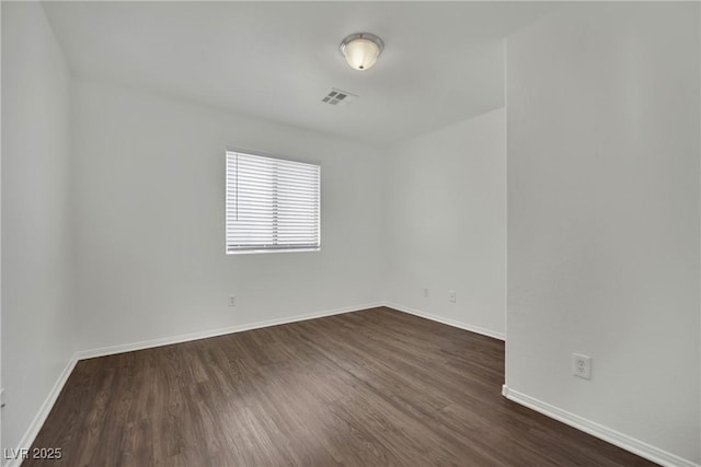 6525 Bismark Hills St, North Las Vegas, NV 89084 - unfurnished room with dark wood-style floors and baseboards
