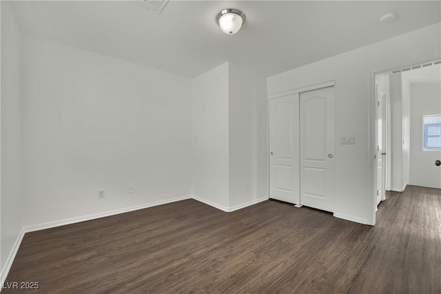 6525 Bismark Hills St, North Las Vegas, NV 89084 - unfurnished room featuring dark wood-style floors and baseboards