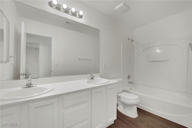 6525 Bismark Hills St, North Las Vegas, NV 89084 - full bath with double vanity, toilet, shower / bathtub combination, and wood finished floors