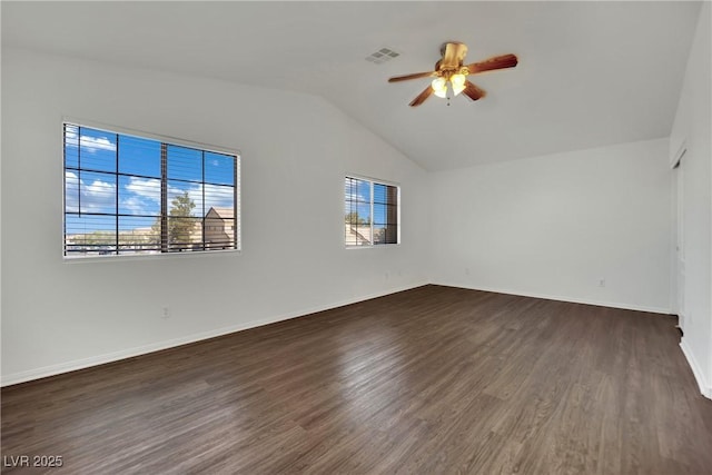 6525 Bismark Hills St, North Las Vegas, NV 89084 - unfurnished room with a ceiling fan, vaulted ceiling, dark wood-style floors, and baseboards