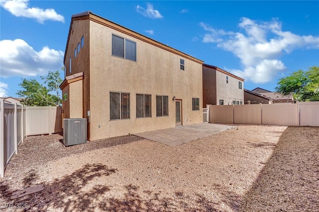 6525 Bismark Hills St, North Las Vegas, NV 89084 - back of house featuring central AC unit, a patio area, a fenced backyard, and stucco siding
