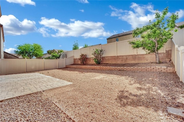 6525 Bismark Hills St, North Las Vegas, NV 89084 - fenced backyard with a patio