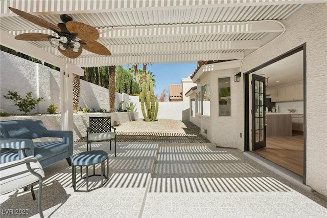 view of patio with ceiling fan and a fenced backyard