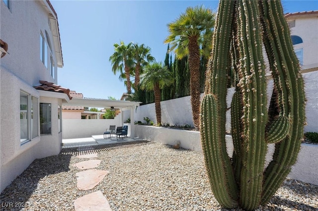 view of yard with a fenced backyard and a patio area