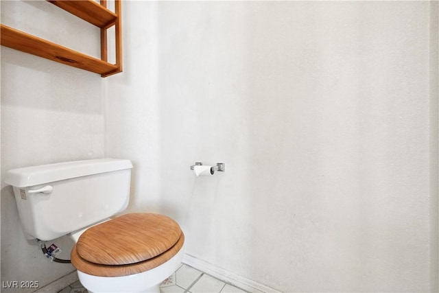 bathroom with tile patterned floors and toilet