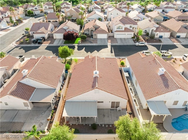 birds eye view of property with a residential view