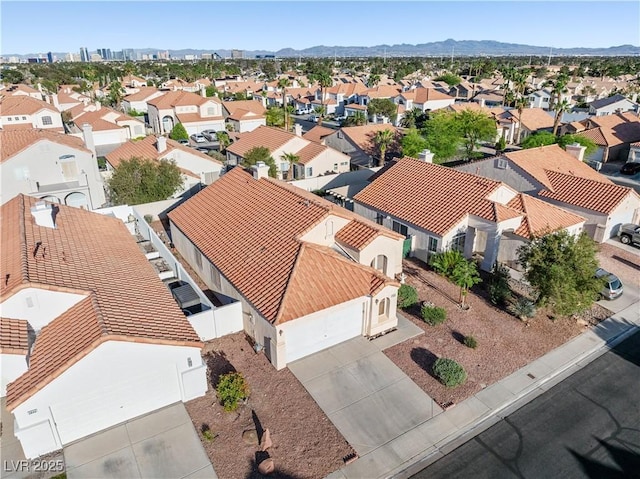 aerial view with a mountain view and a residential view
