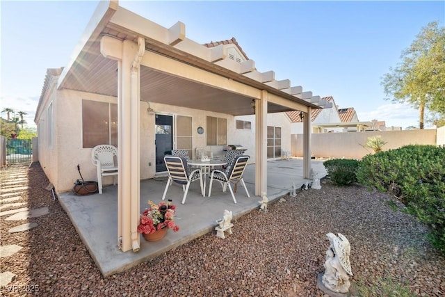 exterior space featuring a fenced backyard, a patio area, and stucco siding