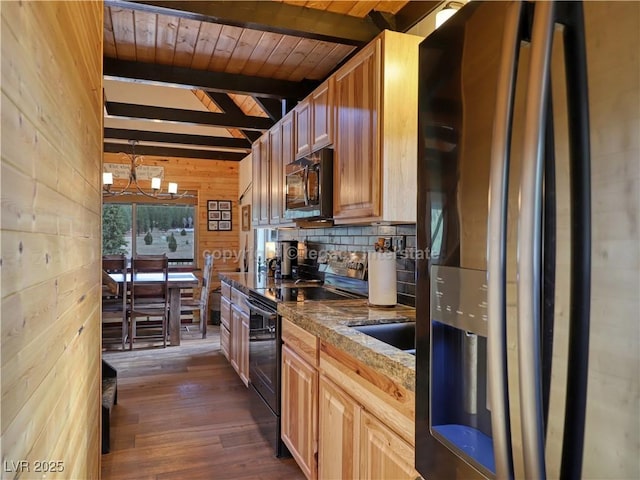 kitchen featuring stainless steel fridge with ice dispenser, beamed ceiling, wooden walls, black range with electric cooktop, and dark wood-type flooring