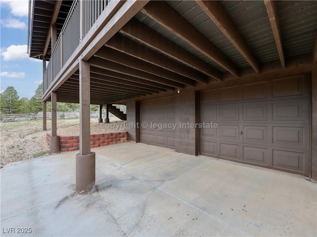 view of patio / terrace with a garage and a carport