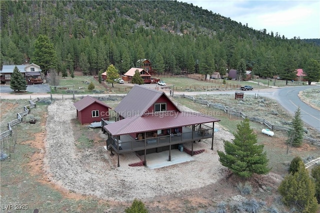 bird's eye view featuring a mountain view and a wooded view