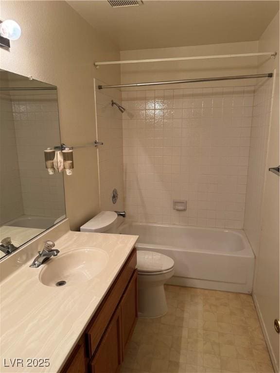 bathroom with toilet, shower / washtub combination, vanity, and tile patterned floors
