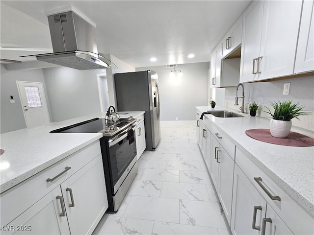 kitchen with marble finish floor, island range hood, recessed lighting, a sink, and stainless steel appliances