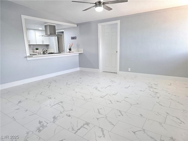 unfurnished living room featuring ceiling fan, baseboards, and marble finish floor