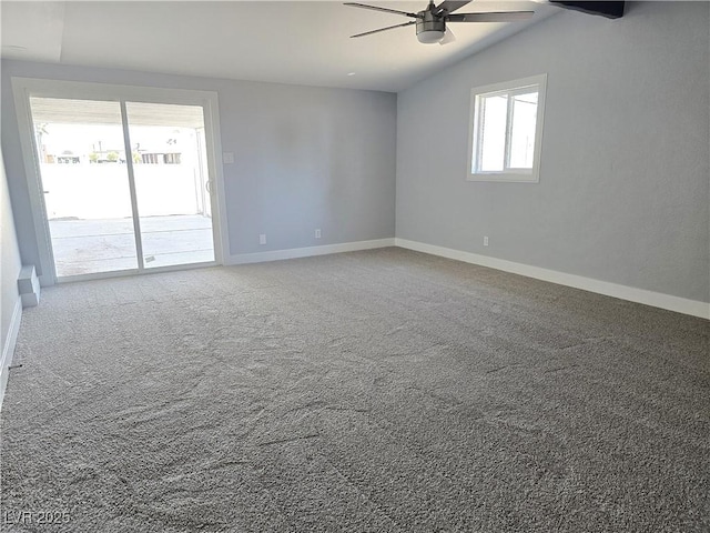 unfurnished room featuring baseboards, ceiling fan, lofted ceiling, and carpet floors